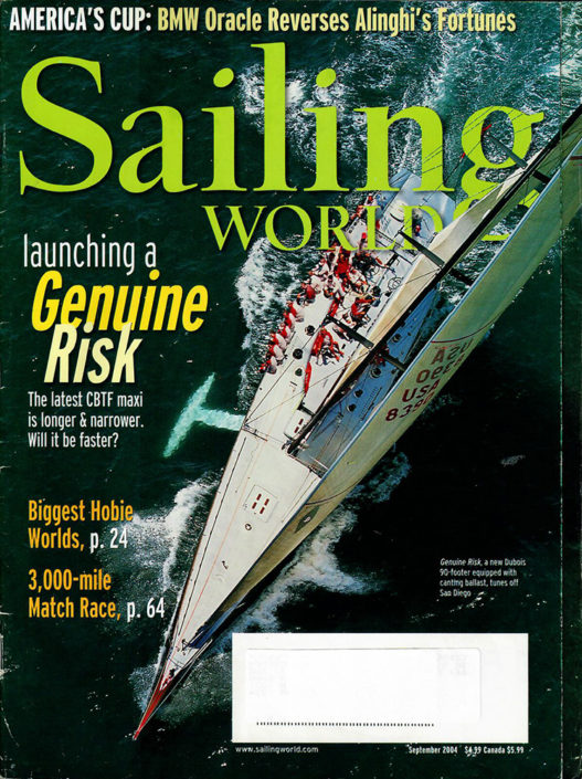 sailing world magazine cover featuring large boat in water with group of men on it